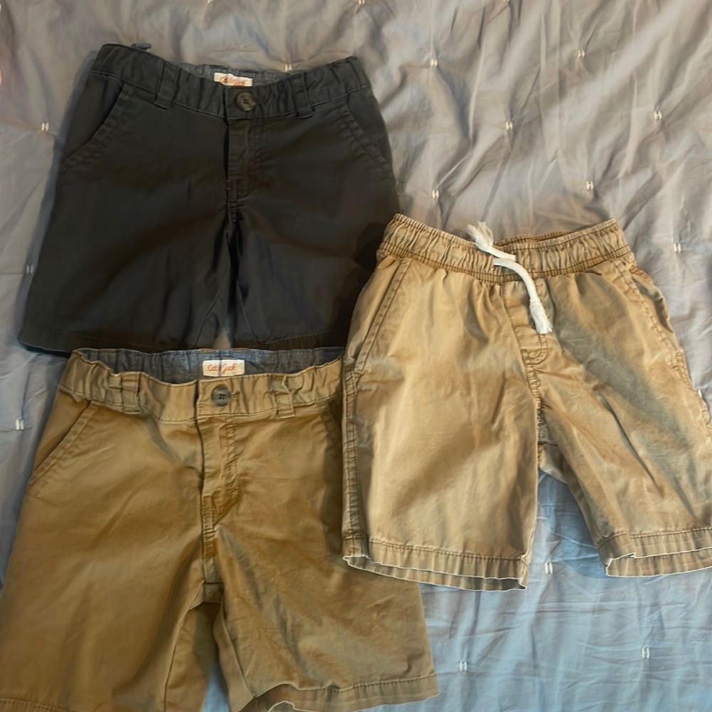 3 pairs of boys shorts. Drawstring shorts are size 4/5. The other 2 are size 5.
